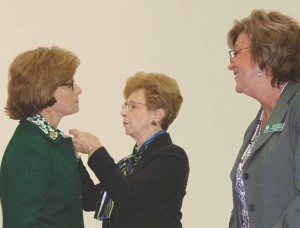 Senator Katrina Shealy receives her Honorary Girl Scout Troop 1912 pin from Belinda Copeland, Chair of the Board, Girl Scouts of Eastern South Carolina, and Mary Winter Teaster, Chair of the Board, Girl Scouts of South Carolina – Mountains to Midlands.