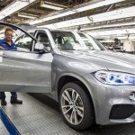 Spartanburg Associate, Carolyn Tate, performs a quality inspection of the new X5.